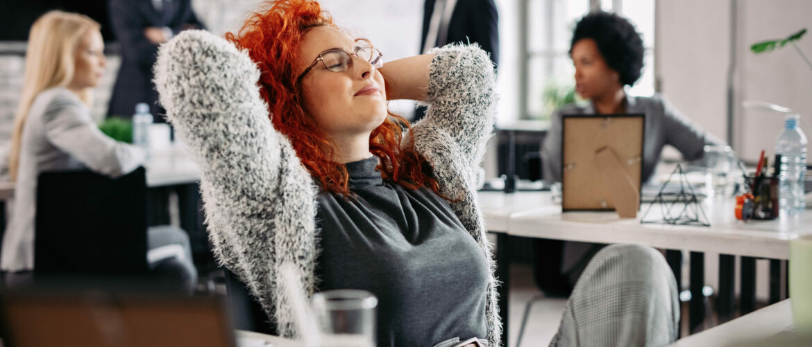 young-creative-businesswoman-with-hands-head-taking-break-resting-with-eyes-closed-office2